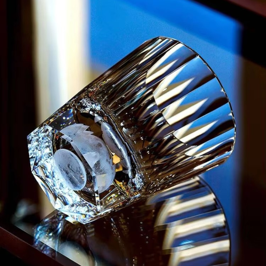 Moon Diamond Cut Crystal Whisky Glass on its side showing the rounded moon base and crystal cuts.