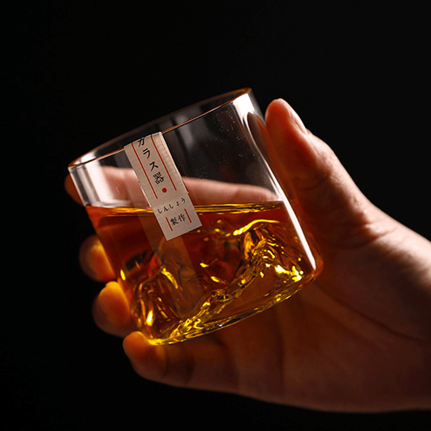 Hand holding the Limited Edition Japanese Whisky Glass - Mt. Asama Inspired Design