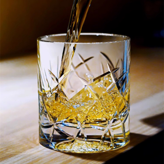 Handcrafted crystal whisky glass with intricate Kiriko cut design inspired by ocean waves, featuring a heavy bottom for a luxurious feel.