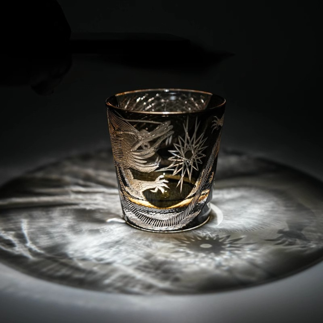 Detailed patterns illuminating from our Edo Kiriko Dragon Whisky Glass made from premium K9 crystal, featuring an intricate hand-cut dragon design.