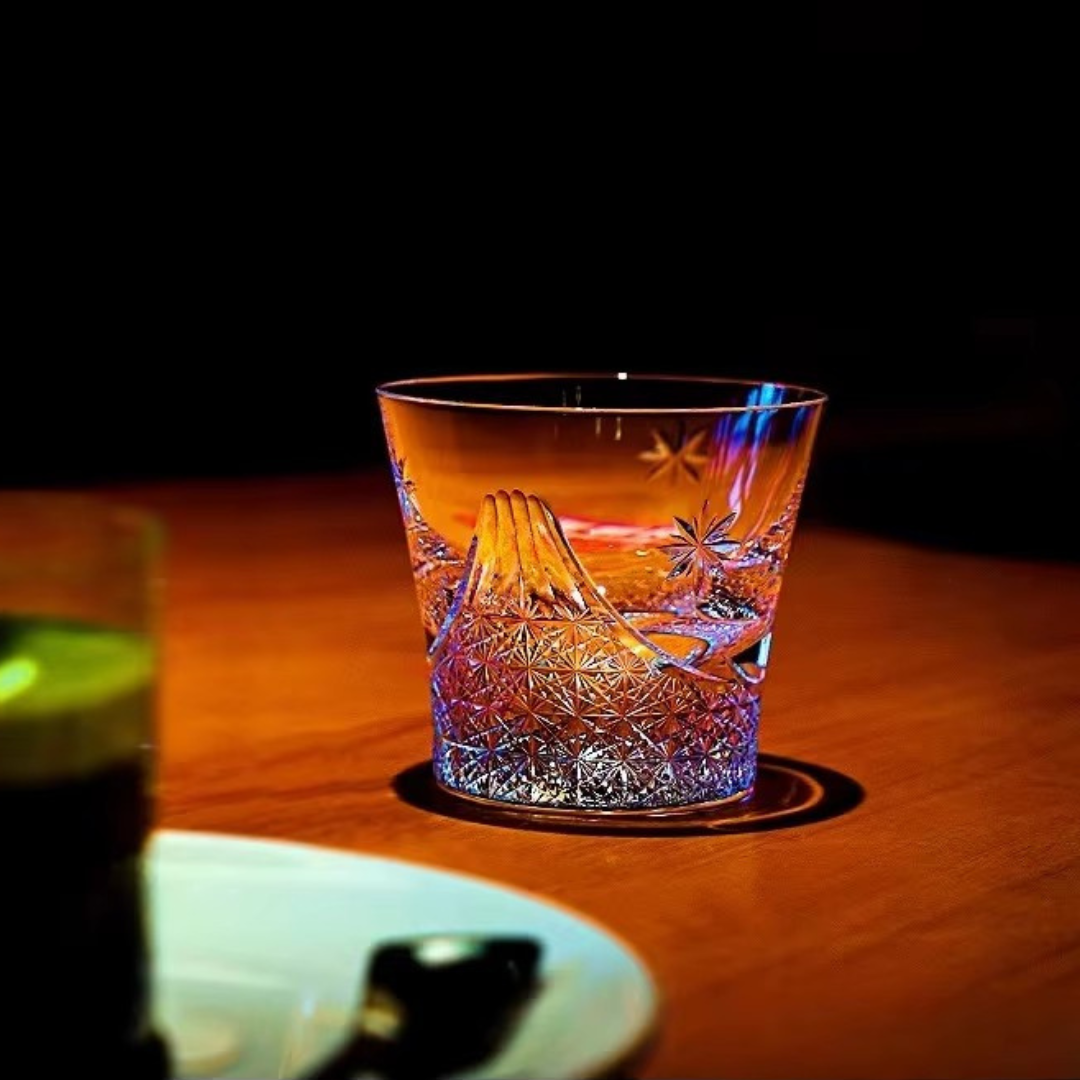 Mount Fuji Flower Crystal Whisky Glass on table showing wide silhouette and reflective cut detailing.