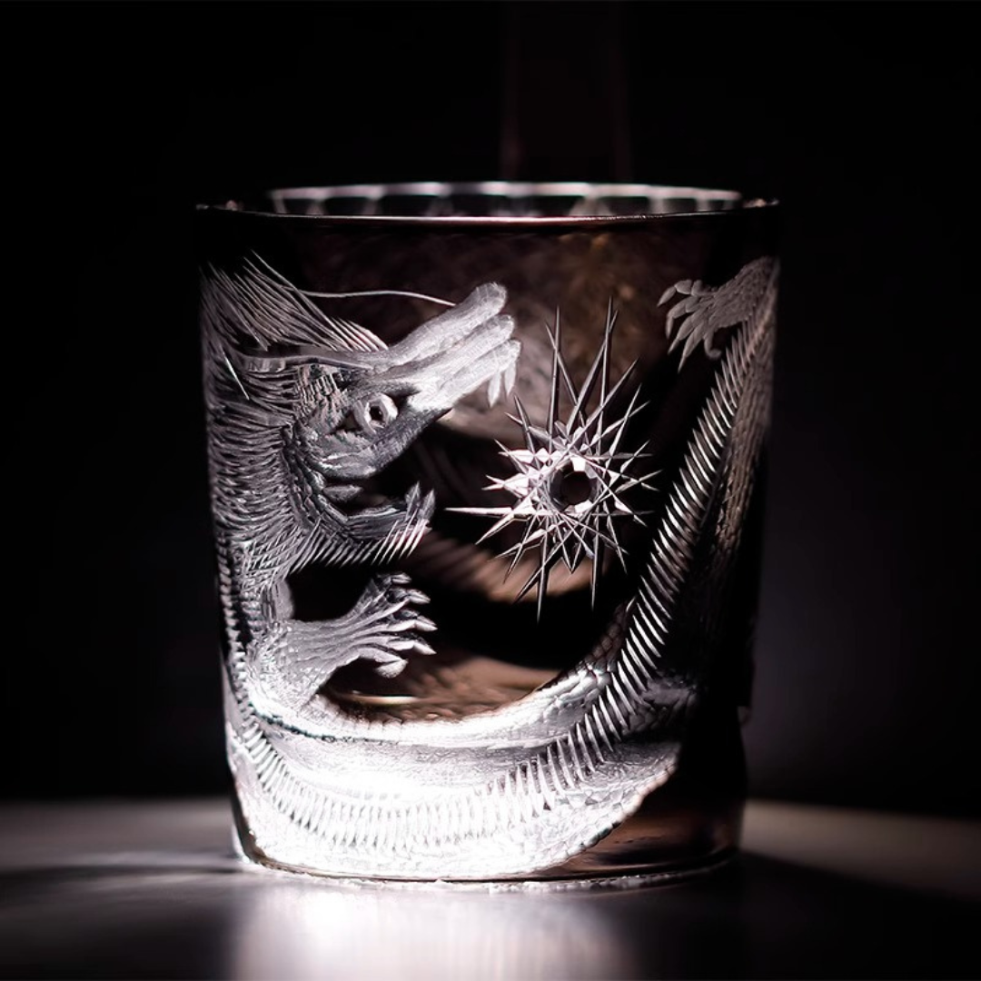 Close-up of our Edo Kiriko Dragon Whisky Glass made from premium K9 crystal, featuring an intricate hand-cut dragon design with sharp detailing, illuminated against a dark background.