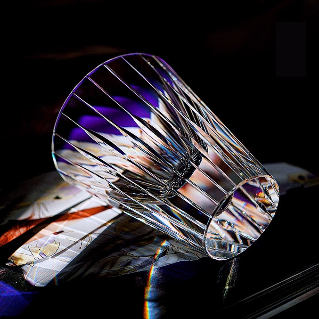 Light reflecting on our handcrafted crystal whisky glass inspired by the Japanese Koto instrument