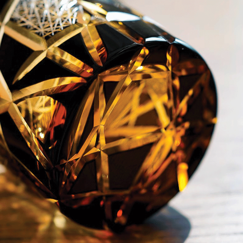 Close up of Black Edo Whisky Glass with Amber Gold Pattern on Tinted Glass