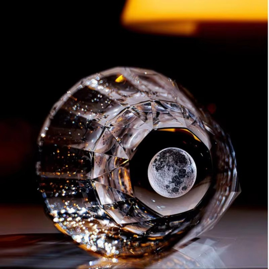 Moon Diamond Cut Crystal Whisky Glass showing sculpted moon-inspired base and crystal facets.