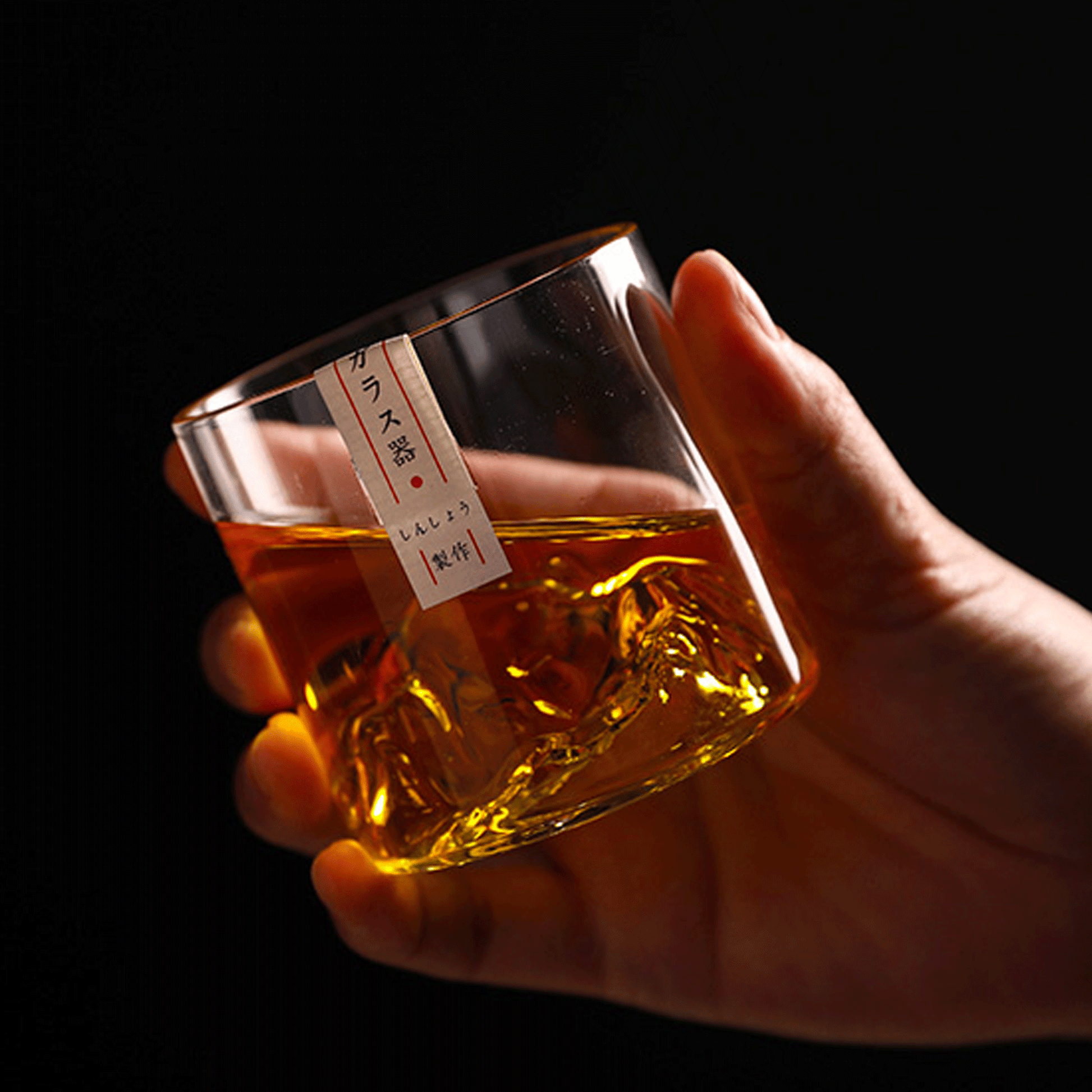 Hand holding the Limited Edition Japanese Whisky Glass - Mt. Asama Inspired Design